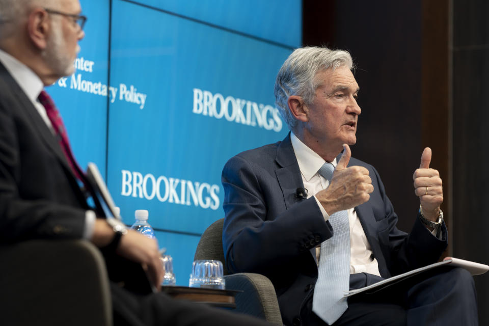 David Wessel, director of the Hutchins Center, left, and Federal Reserve Chair Jerome Powell, right, answer questions following Powell's speech at the Hutchins Center on Fiscal and Monetary Policy at the Brookings Institute on Wednesday, Nov. 30, 2022, in Washington. (AP Photo/Nathan Howard)