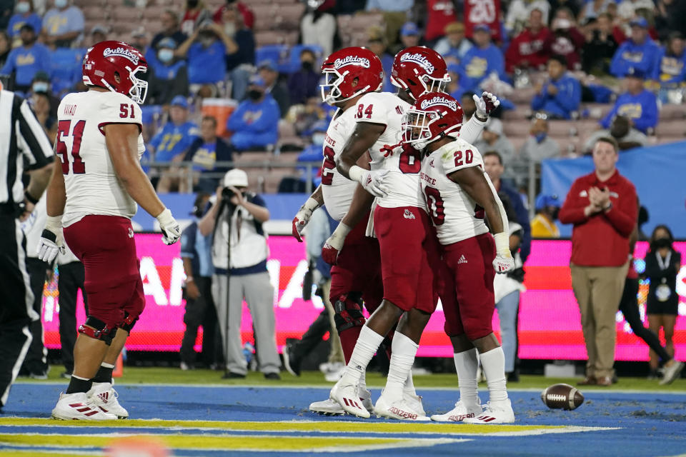 Fresno State running back Ronnie Rivers (20) celebrates his rushing touchdown with teammates during the first half of an NCAA college football game against UCLA on Saturday, Sept. 18, 2021, in Pasadena, Calif. (AP Photo/Marcio Jose Sanchez)