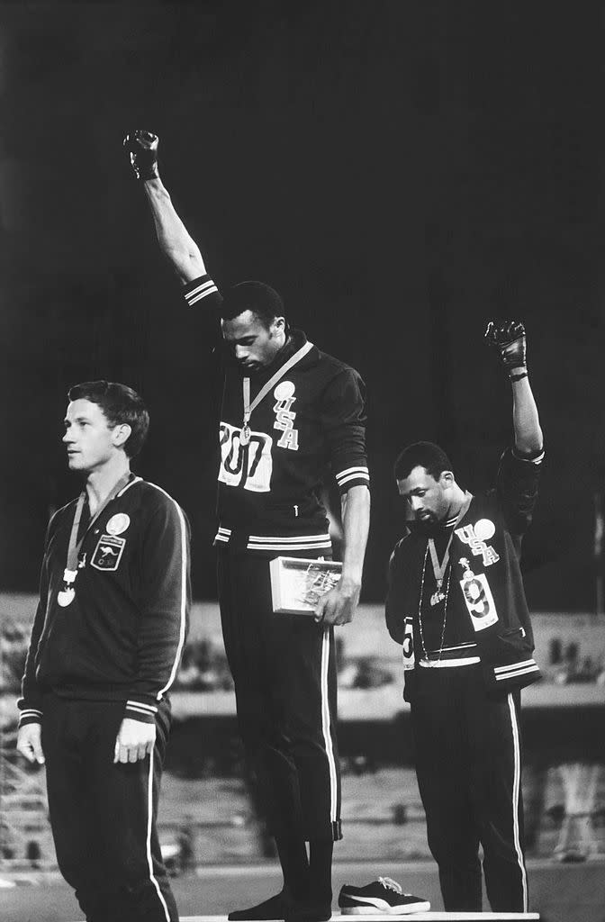 American track and field athletes Tommie Smith (C) and John Carlos (R), protest with the Black Power salute at the Summer Olympic games, Mexico City, Mexico, October 19, 1968. | John Dominis/The LIFE Picture Collection via Getty Images