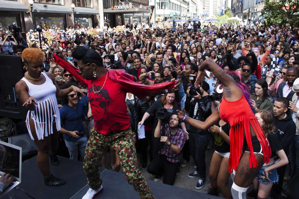 Participants dressed in colourful outfits perform to a vast audience in New York. (Reuters)