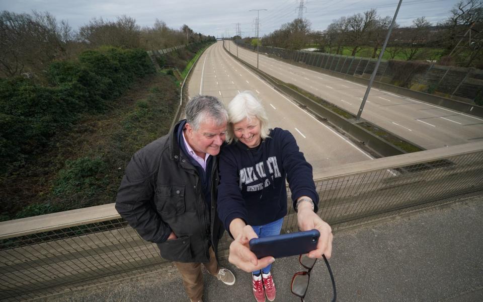 Fiona and Patrick Potter, residents of West Byfleet take a selfie on the Parvis Road bridge in Byfleet