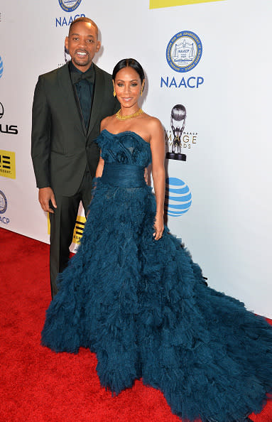 Will Smith with wife Jada Pinkett Smith in a teal gown at the 47th NAACP Image Awards at Pasadena Civic Auditorium in Pasadena, California.