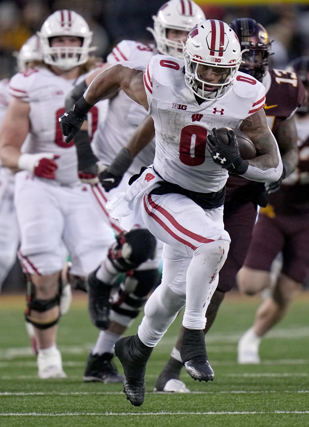 Wisconsin running back Braelon Allen takes off on a 50-yard run during the third quarter against Minnesota. He scored a touchdown on the next play.