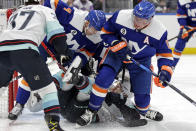 Seattle Kraken center Mason Appleton crashes into New York Islanders defenseman Andy Greene (4) behind Josh Bailey (12) in the first period of an NHL hockey game Wednesday, Feb. 2, 2022, in Elmont, N.Y. (AP Photo/Adam Hunger)