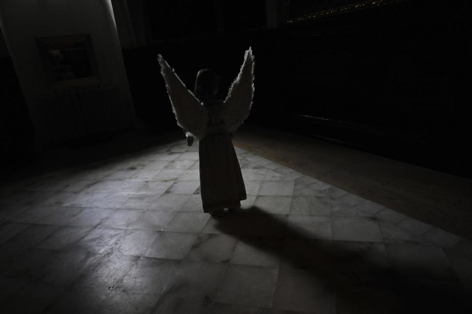 Asier Jimenez, 8, stands, dressed as an angel, during the Easter Sunday ceremony ''Descent of the Angel'', during Holy Week in the small town of Tudela, northern Spain, Sunday, April 20, 2014. (AP Photo/Alvaro Barrientos)