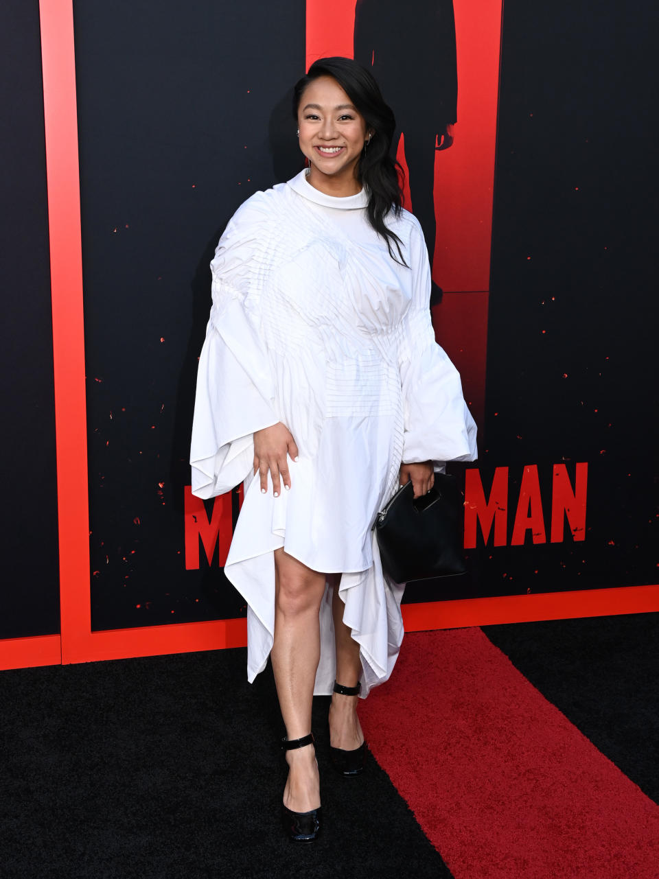 Stephanie Hsu wearing black patent leather shoes at "Monkey Man" premiere