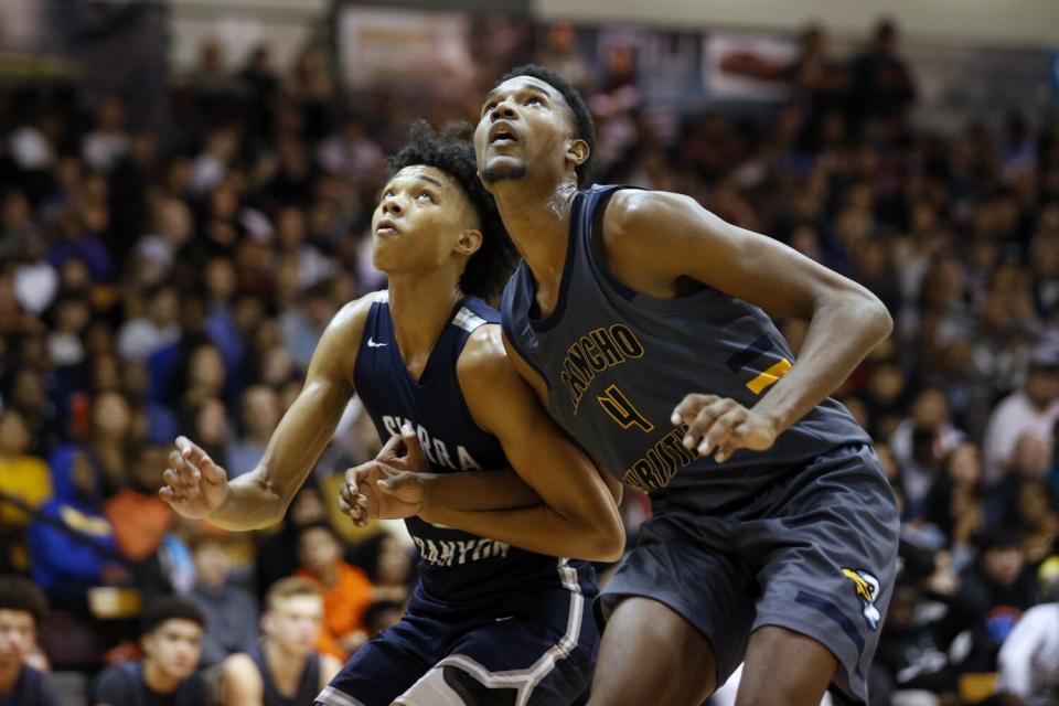 Evan Mobley, right, battles Sierra Canyon's Brandon Boston Jr. for rebounding position while playing for Rancho Christian.