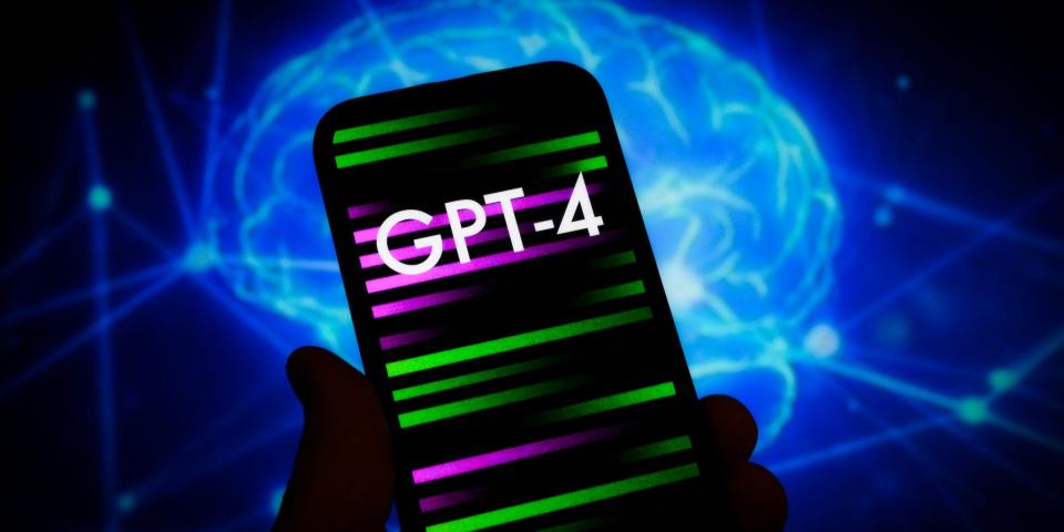 person holding phone with the word 'gpt-4' on it