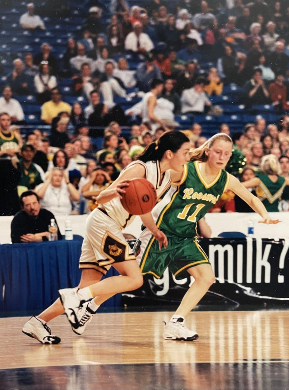 Lindsey Foster drives during a state tournament game against Roosevelt at the Tacoma Dome. The 1999 SK grad led the Wolves to a third-place finish in state that year and was named Narrows League MVP.