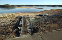 Floating docks rest on dry land far from the water as they are closed due to low water levels on Lake Lanier at Mary Alice Park in Cumming, Ga., Monday, Nov. 26, 2012. Mary Alice Park is a Corps of Engineers Park whose boat ramp and floating docks are closed due to low water levels. Lake Lanier is at its lowest level since the historic drought of several years ago, when lakeside businesses lost millions in recreation revenue and boaters were unable to launch their crafts. Monday's level was 1,058 feet above sea level, 13 feet below full pool. The last time Lake Lanier was at that level was in March 2009, the last days of the two-year drought that ravaged the state. (Jason Getz/Atlanta Journal-Constitution via AP)