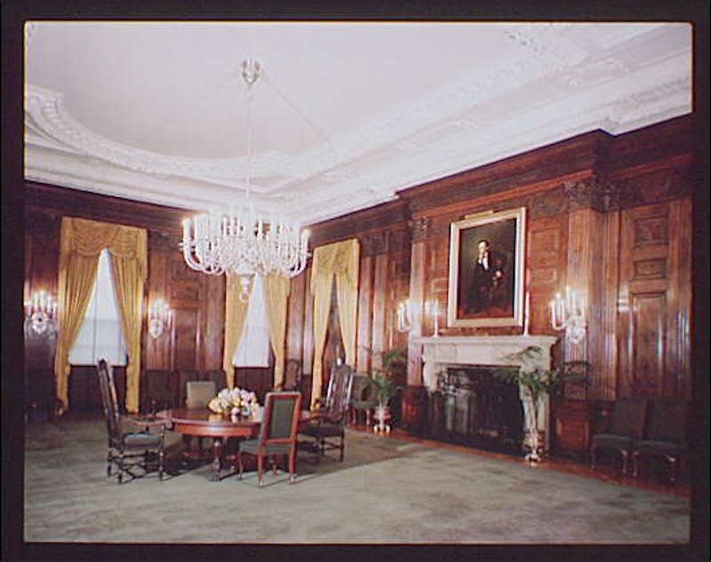 The White House State Dining Room, circa 1948, with wood paneling and carpet