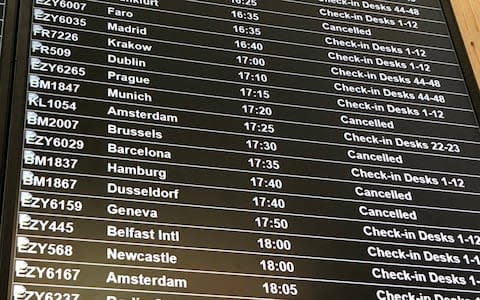 A departure board at Bristol Airport showing flybmi flights cancelled following the collapse of the airline - Credit: PA