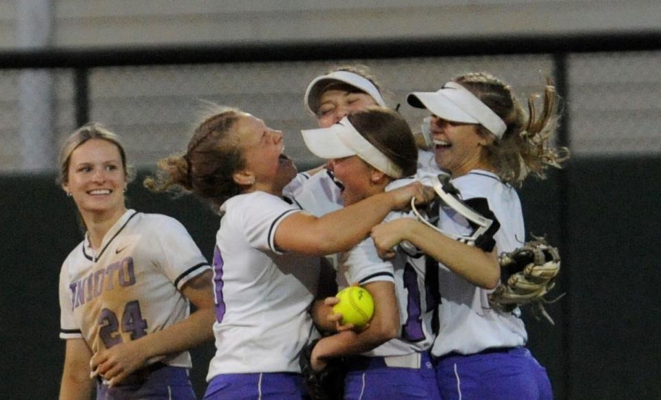 Unioto's Morgan Daniels (#24), Hannah Hull (#10), Halle Uhrig (#14), Alexis Book (#21) and Amaris Betts (#1) celebrate in the outfield after defeating Hillsboro 6-2 in the Division II district finals at Ohio Softball Field on May 18, 2023.