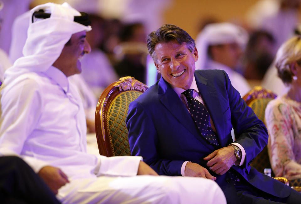 Emir of Qatar Sheikh Tamim bin Hamad Al Thani speaks to IAAF President Sebastian Coe ahead of the opening ceremony for the World Athletics Championships on the Corniche in Doha, Qatar, Friday, Sept. 27, 2019. (AP Photo/Hassan Ammar)