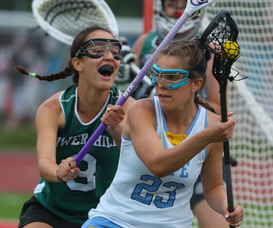 Tower Hill's Amelia Gregory (left) defends as Cape Henlopen's Molly Mendes looks for an opening.