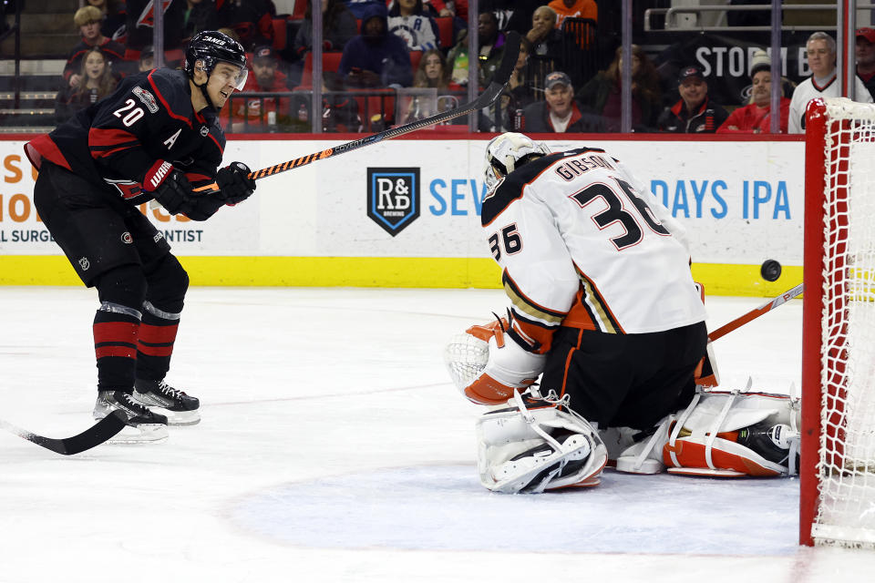 Carolina Hurricanes' Sebastian Aho (20) has his shot deflect wide past Anaheim Ducks goaltender John Gibson (36) during the second period of an NHL hockey game in Raleigh, N.C., Saturday, Feb. 25, 2023. (AP Photo/Karl B DeBlaker)