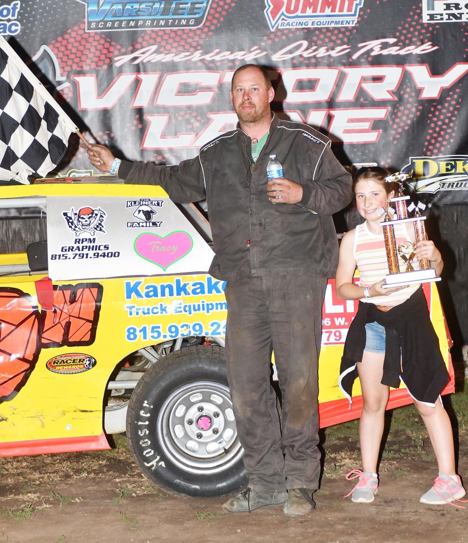 Chebanse's Don Hilleary, here with his daughter Kinzley, took the second stock car feature race at the Fairbury Speedway last weekend. Hilleary, a four-time track champion at the Kankakee County Speedway who currently ranks fourth there and second at Fairbury.