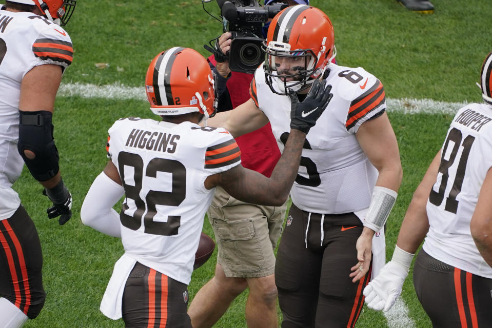 Cleveland Browns wide receiver Rashard Higgins (82) celebrates with quarterback Baker Mayfield (6) after the two connected for a touchdown during the first half of an NFL football game against the Pittsburgh Steelers in Pittsburgh, Sunday, Oct. 18, 2020. (AP Photo/Gene J. Puskar)