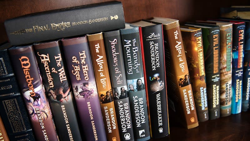 Books written by fantasy author Brandon Sanderson occupy a book shelf at his home in American Fork on Thursday, Sept. 29, 2016. With a massive catalog to choose from, it can be hard to know where to begin reading Sanderson's works. But there are actually a couple of good places.