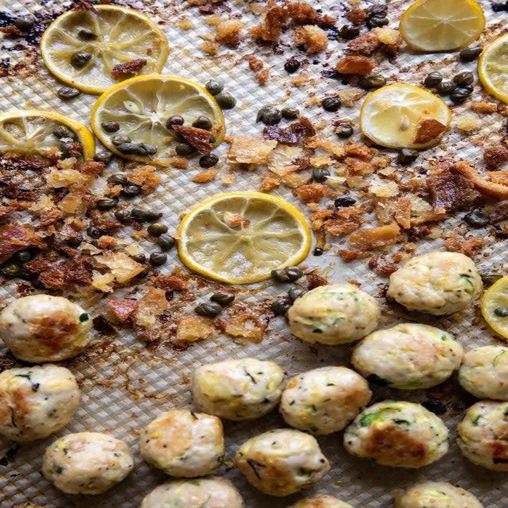 Zucchini meatballs on a sheet pan.