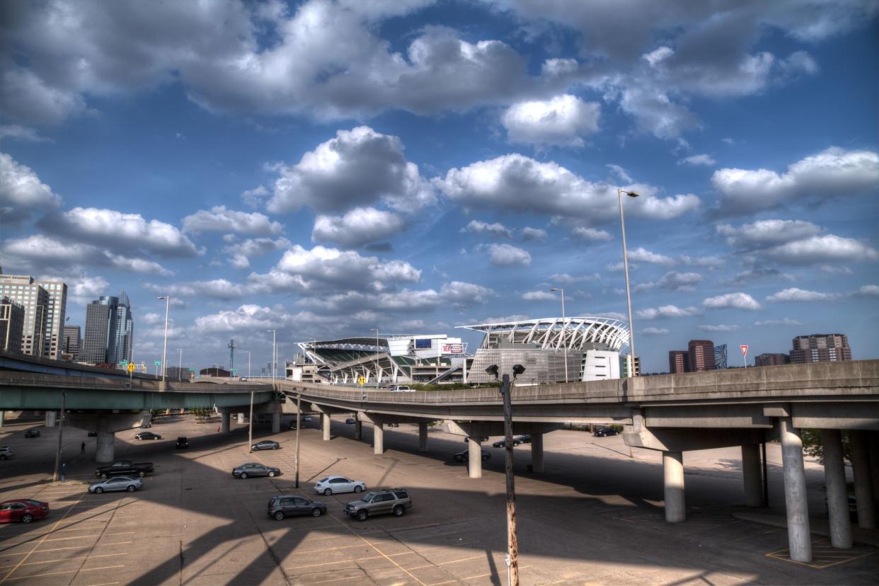 Cincinnati Bengals, Paycor Stadium, Cincinnati, as seen from the parking lot in the foreground, with dramatic clouds against a blue sky