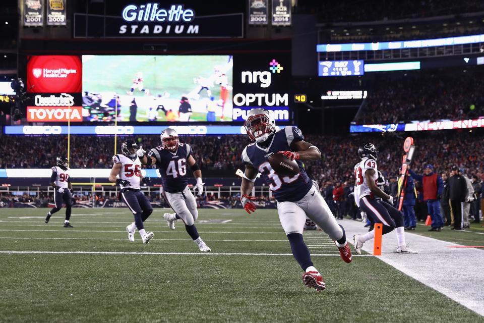 <p>Dion Lewis #33 of the New England Patriots scores a touchdown in the first quarter against the Houston Texans during the AFC Divisional Playoff Game at Gillette Stadium on January 14, 2017 in Foxboro, Massachusetts. (Photo by Elsa/Getty Images) </p>