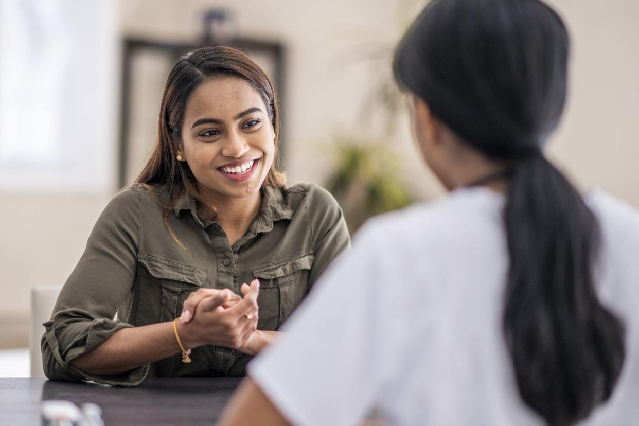 stressed-out woman is chatting with her mental health counselor