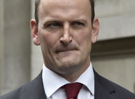 Member of Parliament (MP) Douglas Carswell reacts to reporters questions in central London August 28, 2014. REUTERS/Toby Melville