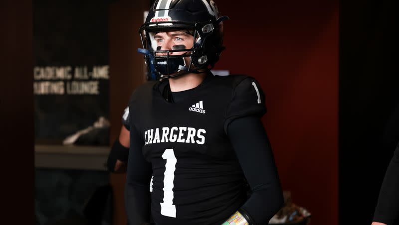 Corner Canyon quarterback Isaac Wilson prepares to face Farmington in a 6A football semifinal at Rice-Eccles Stadium in Salt Lake City on Thursday, Nov. 10, 2022.