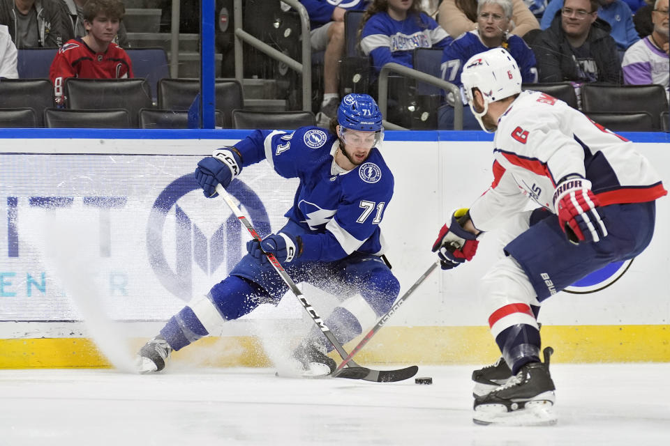 Tampa Bay Lightning center Anthony Cirelli (71) stops in front of Washington Capitals defenseman Joel Edmundson (6) during the second period of an NHL hockey game Thursday, Feb. 22, 2024, in Tampa, Fla. (AP Photo/Chris O'Meara)