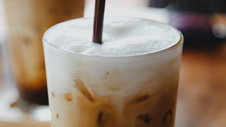 Cold foam on iced coffee drink