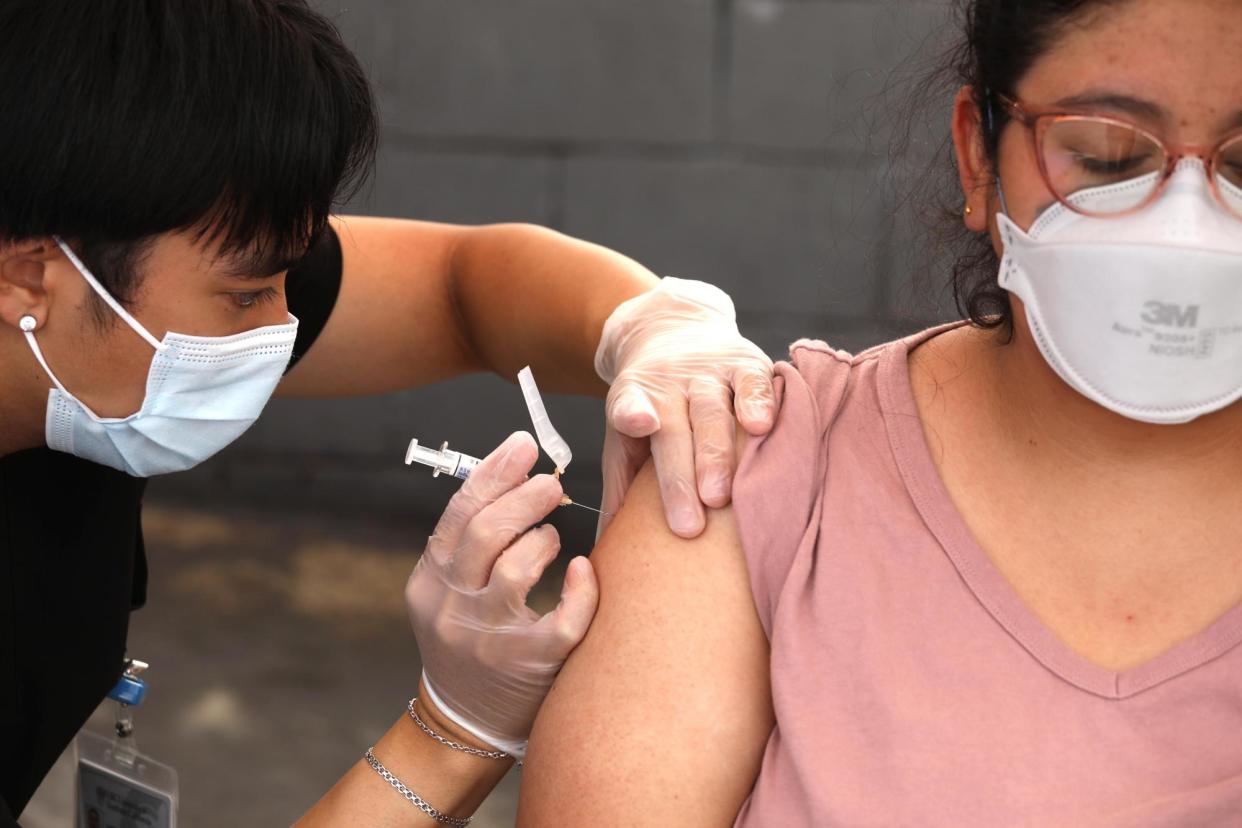 <span>The CDC recommends most Americans get vaccinated in September or October, before an expected winter wave of illness.</span><span>Photograph: Genaro Molina/Los Angeles Times via Getty Images</span>