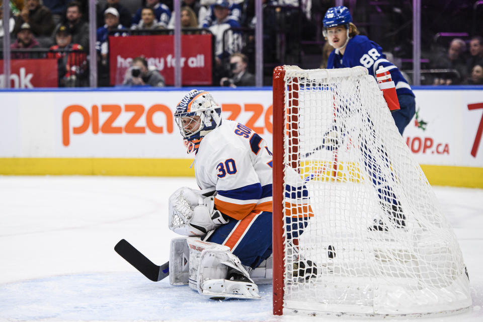 New York Islanders goaltender Ilya Sorokin (30) lets a goal in by Toronto Maple Leafs center John Tavares (91) during second-period NHL hockey game action in Toronto, Monday, Nov. 21, 2022. (Christopher Katsarov/The Canadian Press via AP)