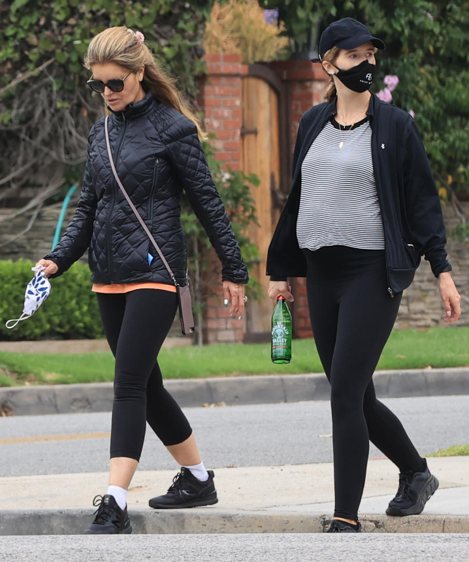 <p>Pregnant Katherine Schwarzenegger takes a stroll with mom Maria Shriver on Wednesday in L.A. </p>