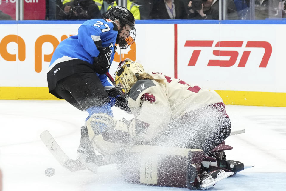 Montreal goaltender Ann-Renee Desbiens saves a shot from Toronto's Emma Maltais during the third period of a PWHL hockey game Friday, Feb. 16, 2024, in Toronto. (Chris Young/The Canadian Press via AP)