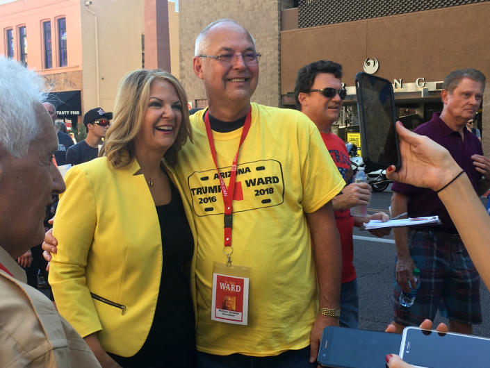 Right-wing Flake challenger Kelli Ward poses with a supporter outside President Trump’s Aug. 22 rally in Phoenix. (Photo: Andrew Romano/Yahoo News)