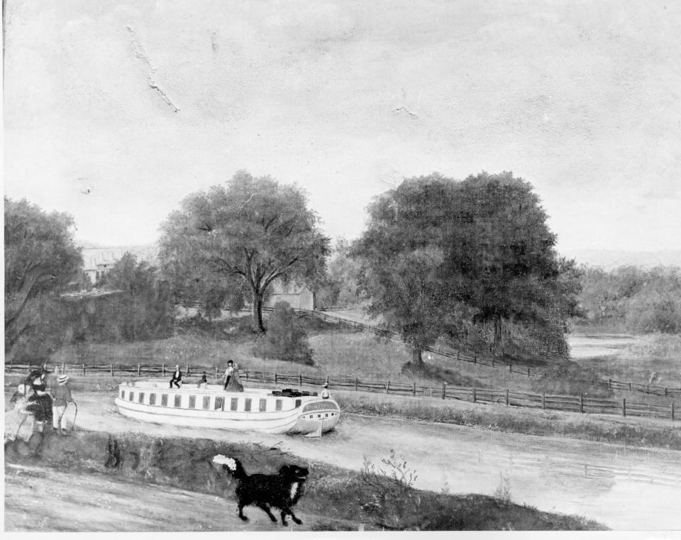 A packet boat on the Chenango Canal approaches the village of Binghamton in the 1850s.