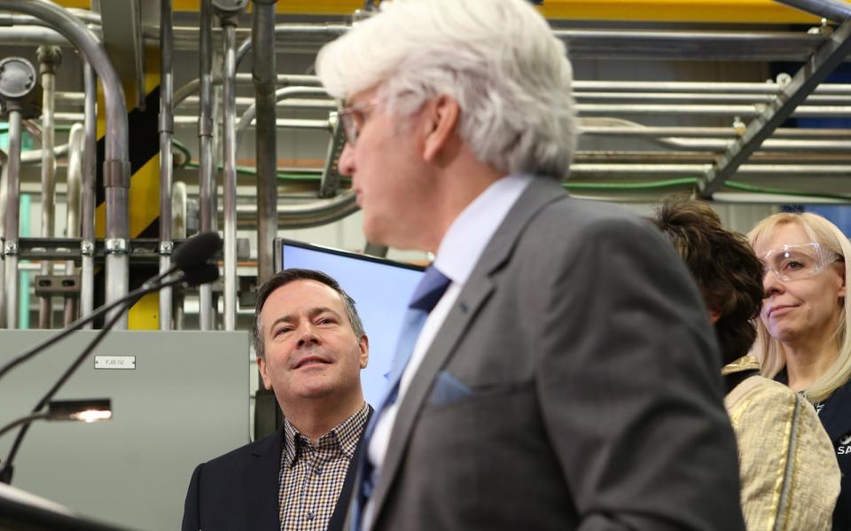 Alberta Premier Jason Kenney looks on as Tom Olsen, managing director of the Canadian Energy Centre, addresses a press conference at SAIT in December.