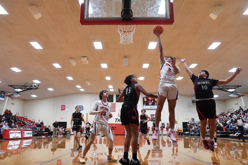 Caney Valley High School's Maverick Condry (2) scores two during basketball action against Morris in Ramona on Dec. 12, 2023. The Trojans defeated Morris, 56-51.