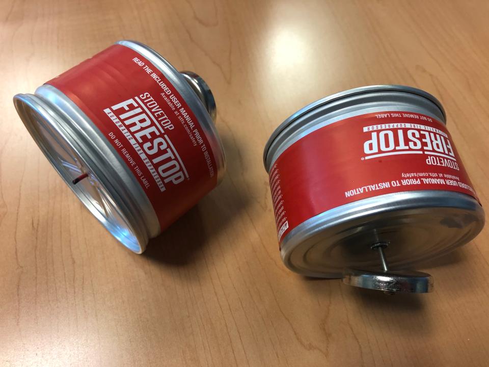 This fire extinguisher is magnetized, fitting just above the kitchen stove, and releases its repellant if a fire ignites the wick at the bottom of the can. It's seen here at the South Bend Fire Department on Wednesday, Jan. 24, 2024.