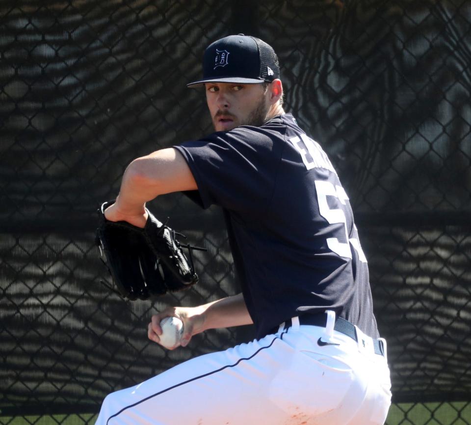 Detroit Tigers pitcher Mason Englert warms up before  live batting practice during Spring Training Tuesday, February 21, 2023.