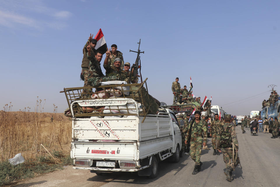 Syrian government forces reinforcements arrive near the city of Ras al-Ayn, in the north of Syria, Saturday, Oct. 26, 2019. (AP Photo)