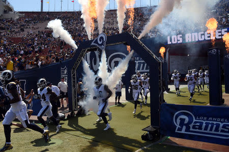 FILE PHOTO: Los Angeles Rams players take the field before a NFL football game against the Indianapolis Colts at Los Angeles Memorial Coliseum in Los Angeles, California, U.S. on September 10, 2017. REUTERS/Richard Mackson/USA TODAY Sports/File Photo