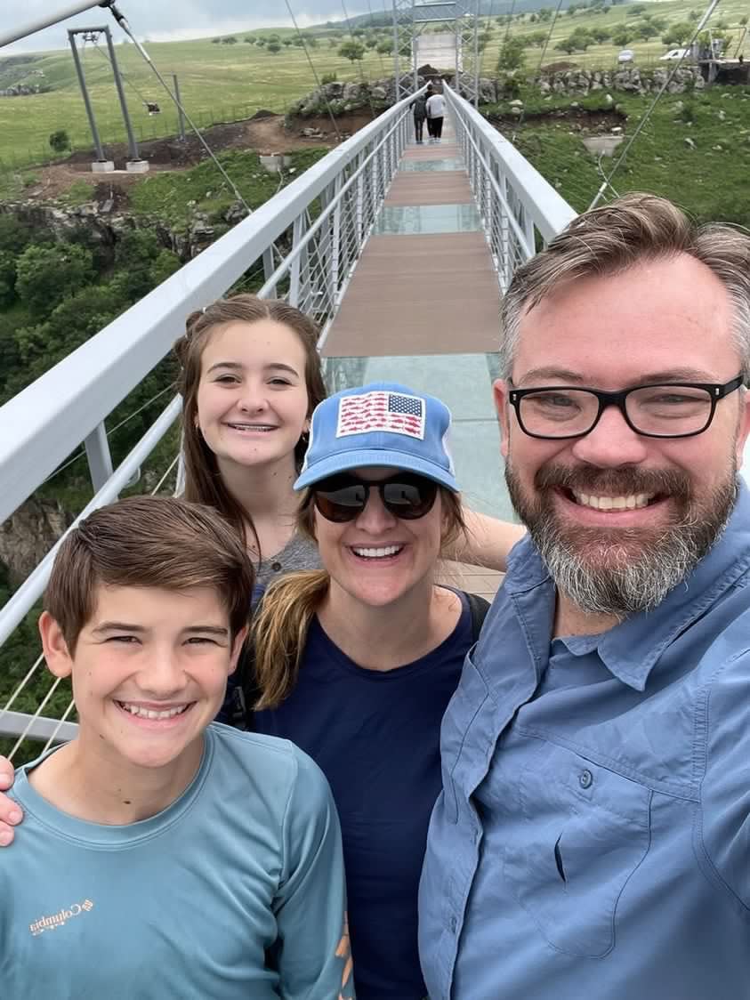 A picture of Werner's family standing on a bridge.