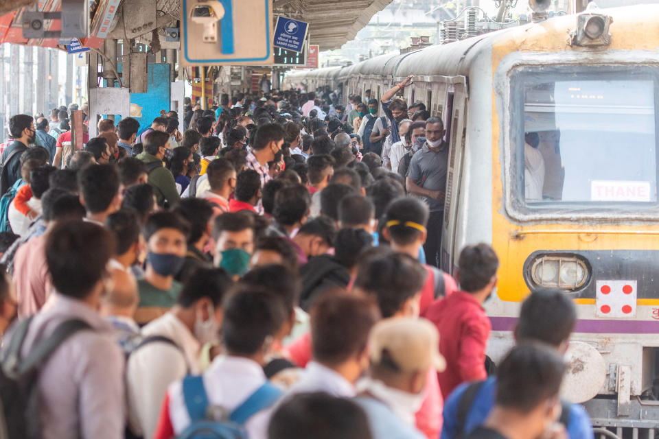 A rush of travellers wait to board a suburban local train at Dadar station, Mumbai, on the first day when local train services started for the general public on Feb 1.<span class="copyright">Pratik Chorge—Hindustan Times/Getty Images</span>