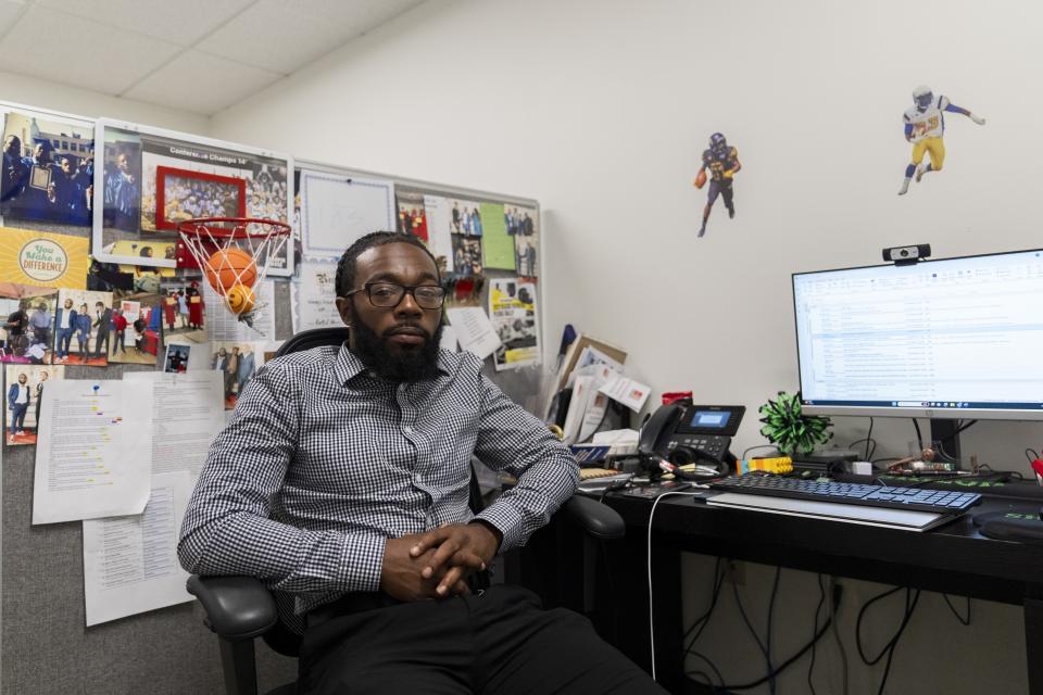 Shiloh Jordan, a Baltimore native whose cannabis conviction was pardoned by an executive order from Maryland Gov. Wes Moore on Monday, poses for a portrait in his office at the Center for Urban Families in Baltimore, Tuesday, June 18, 2024. (AP Photo/Stephanie Scarbrough)
