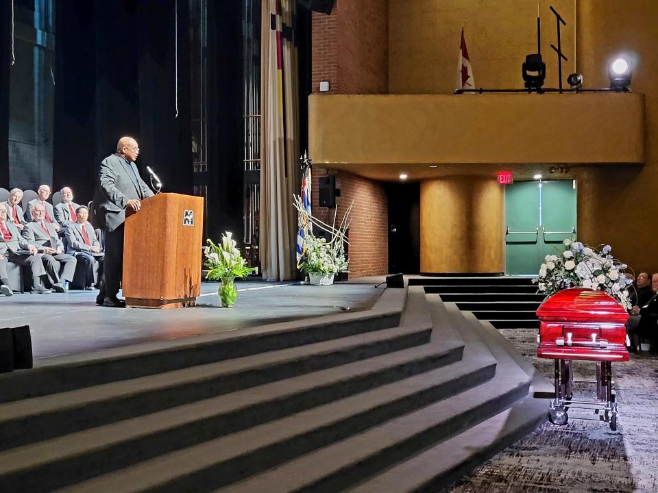 The Rev. Kevin Totty shares closing remarks on Wednesday, April 12, 2023, at McMorran Theater during Jim Acheson's funeral.