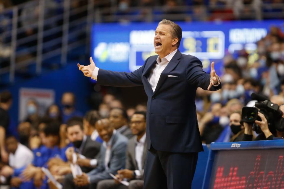 Kentucky basketball coach John Calipari yells out to his team during the second half of a game against Kansas inside Allen Fieldhouse in Lawrence on Jan. 29, 2022.