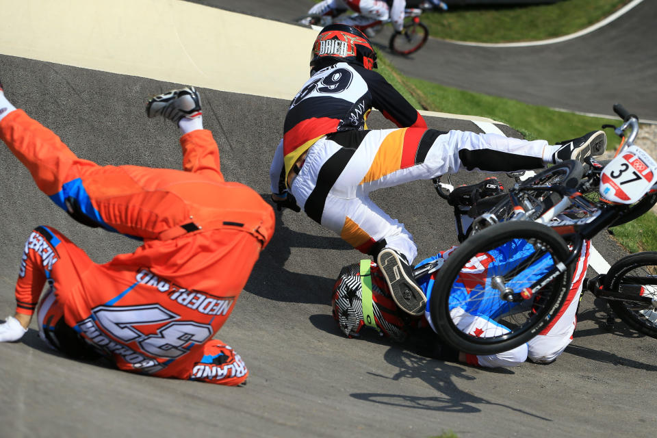 LONDON, ENGLAND - AUGUST 09: (L-R) Jelle Van Gorkom of Netherlands, Maik Baier of Germany, and Tory Nyhaug of Canada crash during the Men's BMX Cycling Quarter Finals on Day 13 of the London 2012 Olympic Games at BMX Track on August 9, 2012 in London, England. (Photo by Phil Walter/Getty Images)