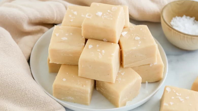 A sack of blond salted caramel fudge on a plate 